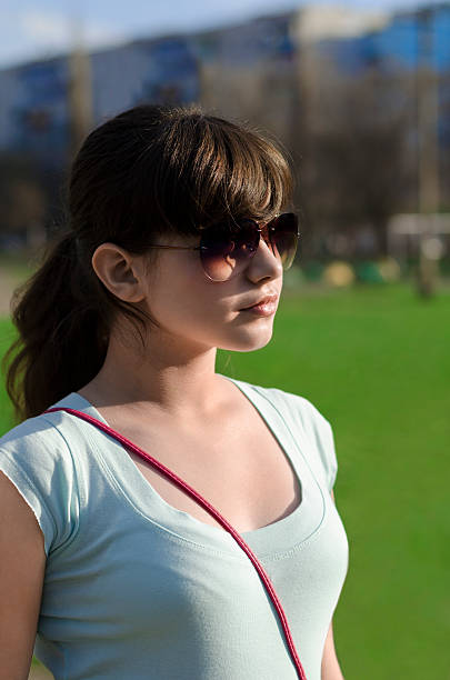 istock young girl in sunglasses 490616119