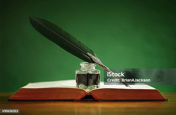 Quill Pen And Inkwell On Old Book Stock Photo - Download Image Now - Quill Pen, Ink, Book