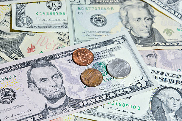 istock American Dollar bills with coins 490616564