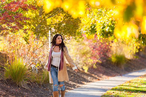 istock Young Woman Walking In The Park 490616966