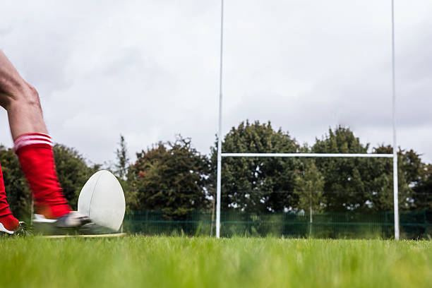 istock Rugby player kicking the ball 490617408