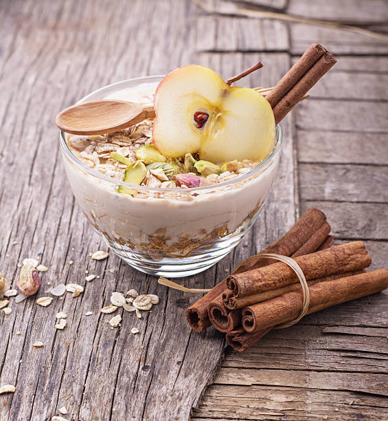 istock Overnight Oatmeal with yogurt, ground cinnamon and slice of apple 490618986
