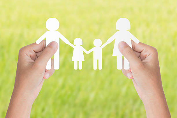 istock hand hold family model over green background 490632950