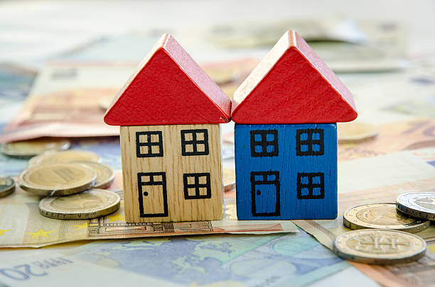 istock house, coins and banknotes 490633310