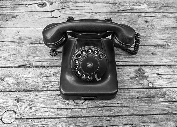 istock Old telephone on wooden background 490635192