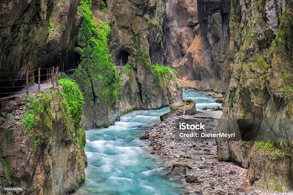 Fabulous gorge and mountain river Partnachklamm The Partnach Gorge is a deep gorge incised by a mountain stream, the Partnach is in the south German town of Garmisch-Partenkirchen. It was designated a natural monument in 1912. Partnach Gorge Stock Photo
