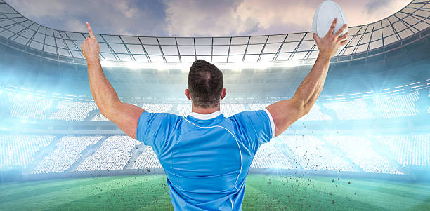 istock Composite image of rugby player cheering with the ball 490635896