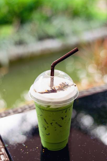 istock Matcha green tea latte clod  on wooden table background 490636496