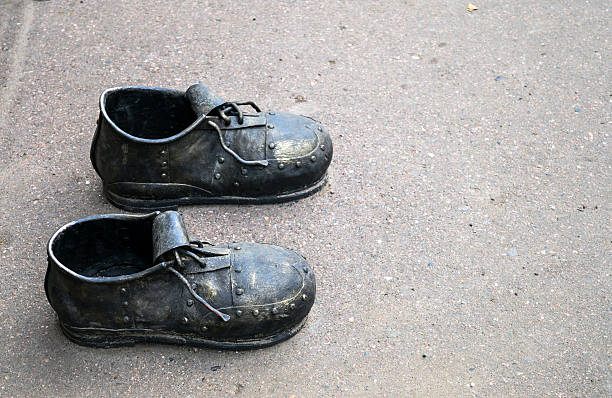 istock Iron shoes/boots sculpture 490637300