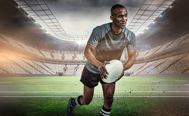 istock Composite image of confident athlete running with rugby ball 490637358