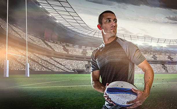 istock Composite image of sober rugby player holding ball 490638054