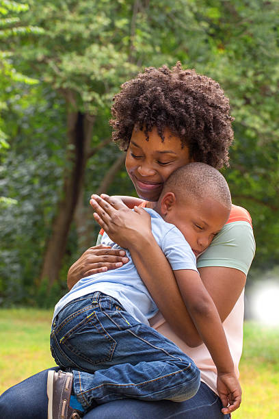 istock African American mother holding her son. 490638476