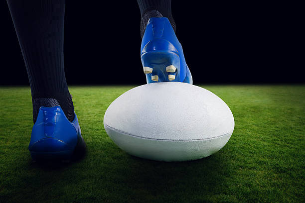 istock Composite image of rugby player posing feet on the ball 490638898