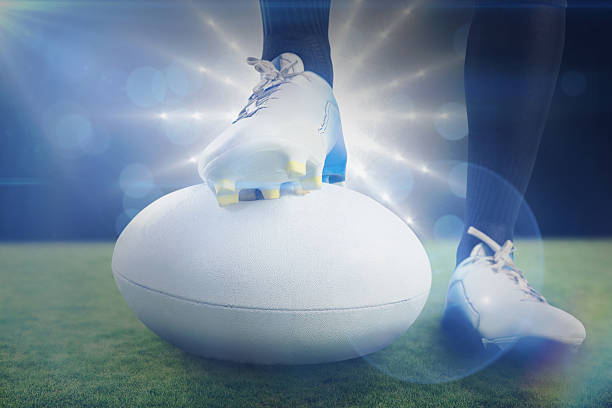 istock Composite image of rugby player posing feet on the ball 490639192