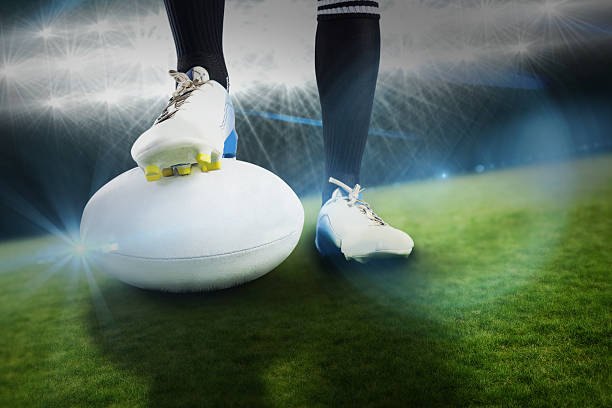 istock Composite image of rugby player posing feet on the ball 490639224