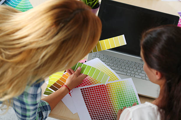 istock Hands of female designer in office working with colour samples 490639396