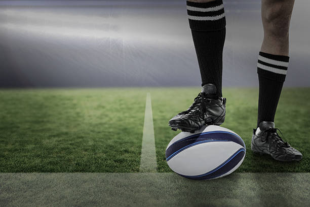 istock Composite image of rugby player in black socks on ball 490639602