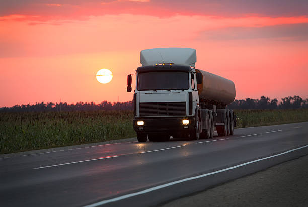 istock fuel truck goes on highway on sunset 490639780