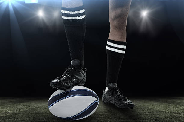 istock Composite image of rugby player in black socks on ball 490639940