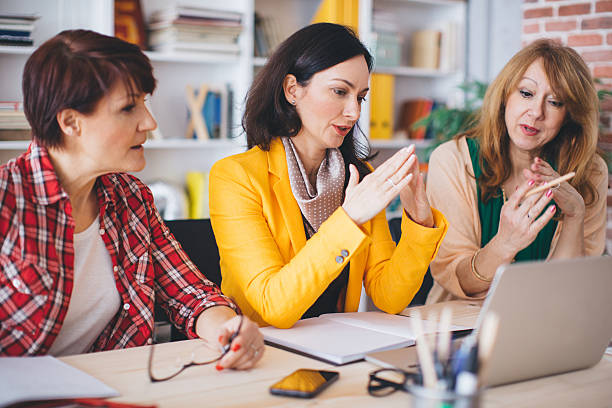 istock Three mature woman working in office. 490640142