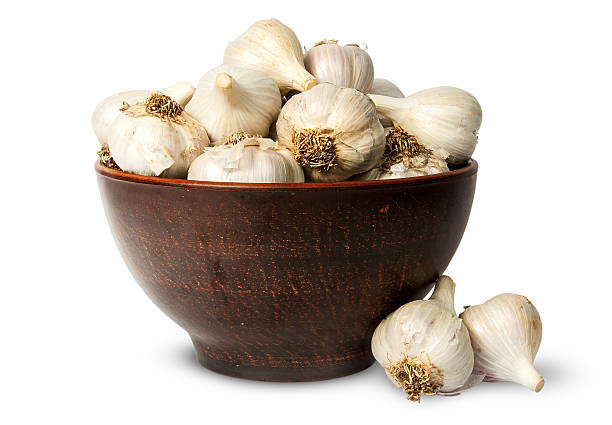istock Whole head of garlic in ceramic bowl 490640564