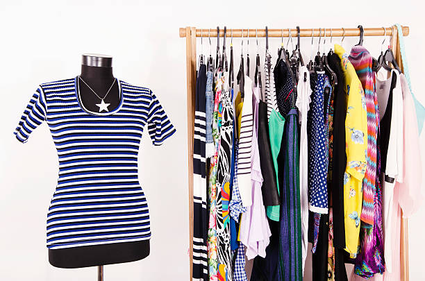istock Dressing closet with colorful clothes arranged on hangers. 490640780