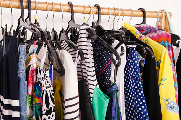 istock Close up on colorful clothes on hangers in a store. 490640844