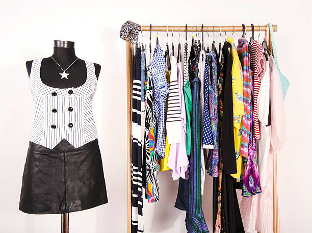 istock Dressing closet with colorful clothes arranged on hangers. 490640882