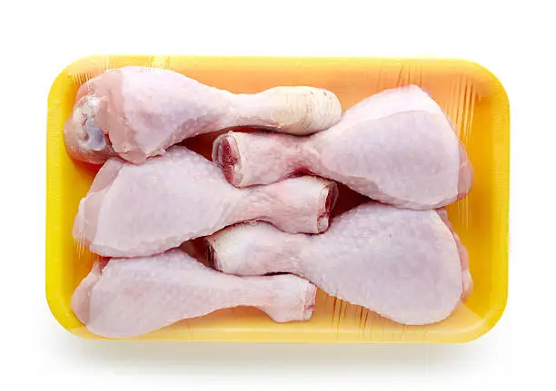 Photo of chicken meat package on white background