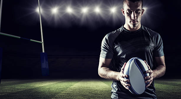 istock Composite image of thoughtful rugby player holding ball 490641606