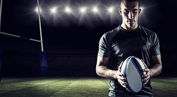 imagem composta de pensativa jogador de rugby segurando bola - clothing team sport serious viewpoint imagens e fotografias de stock