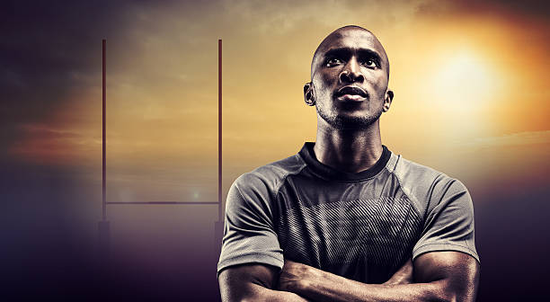 istock Composite image of thoughtful rugby player with arms crossed 490641982
