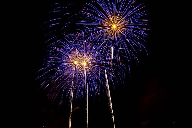 istock Purple and Yellow Fireworks 490642090