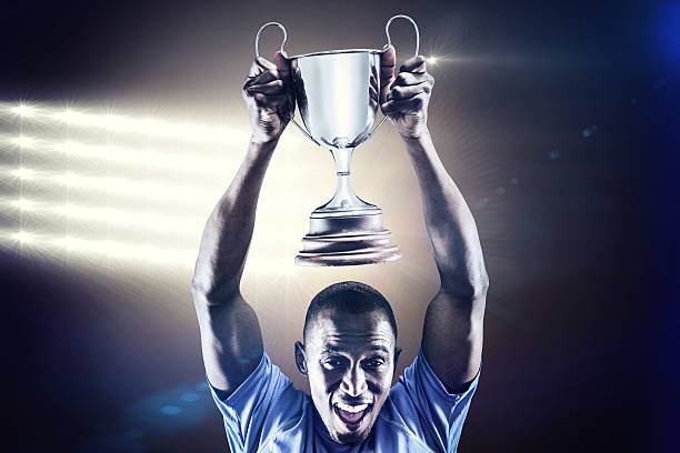 istock Composite image of rugby player with winners cup 490642590