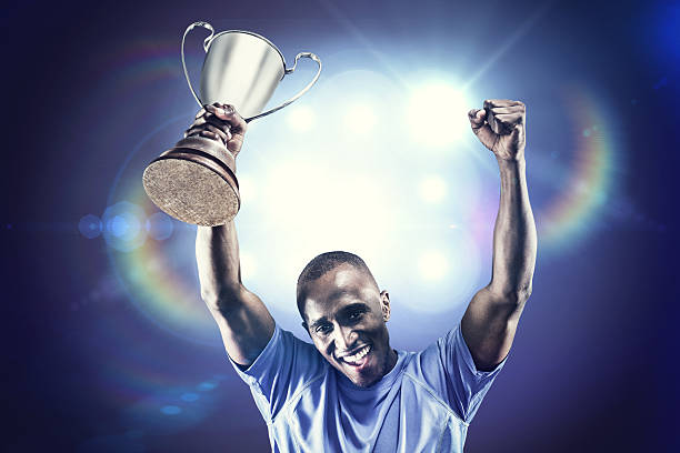 istock Composite image of rugby player with winners cup 490642636