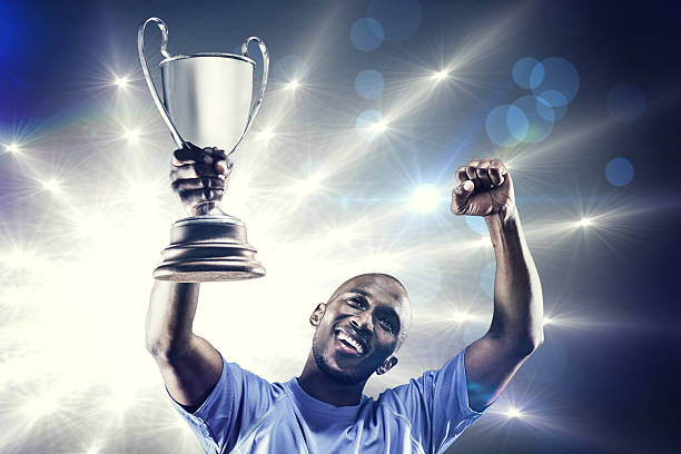istock Composite image of rugby player with winners cup 490642654