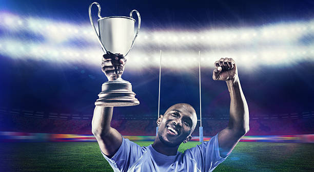 istock Composite image of rugby player with winners cup 490642944