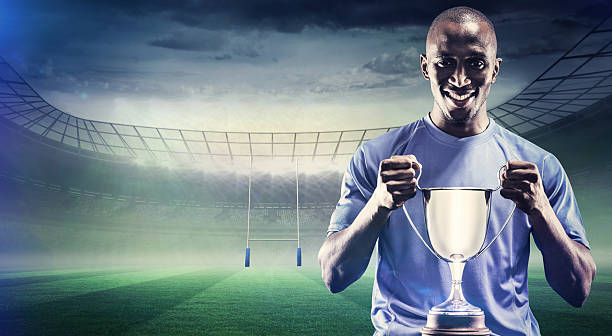 istock Composite image of rugby player with winners cup 490643028