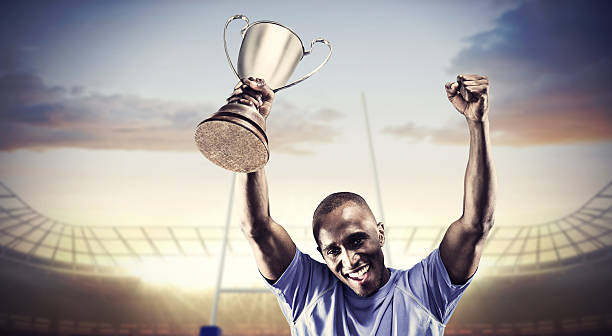 istock Composite image of rugby player with winners cup 490643262