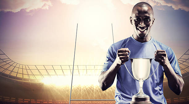 istock Composite image of rugby player with winners cup 490643444