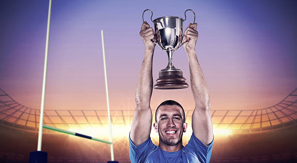 istock Composite image of rugby player with winners cup 490643490