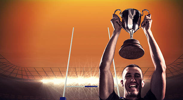 istock Composite image of rugby player with winners cup 490643608