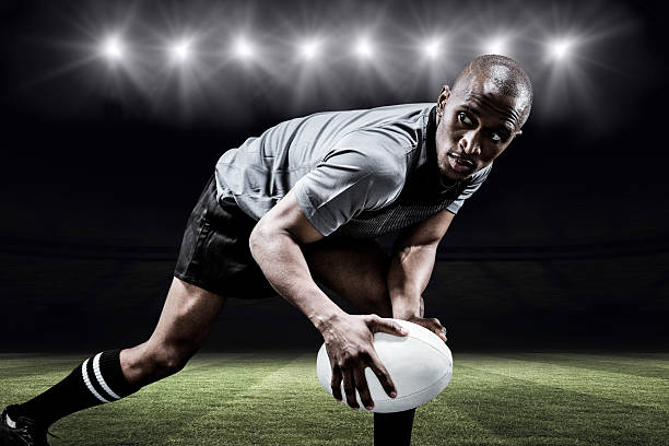 istock Composite image of determined sportsman looking away while playing rugby 490643710