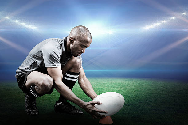 istock Composite image of rugby player keeping ball on kicking tee 490643734