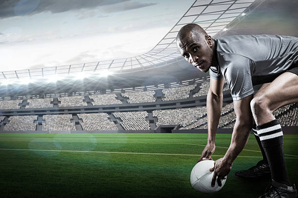 istock Composite image of rugby player playing on pitch 490643796