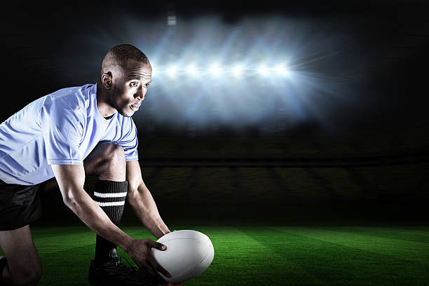 istock Composite image of rugby player playing on pitch 490643924