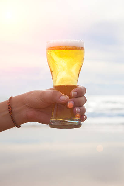 istock woman hand holding a refreshing beer 490645532