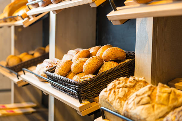 istock Bread and buns on shelf in bakery or baker's shop 490645948