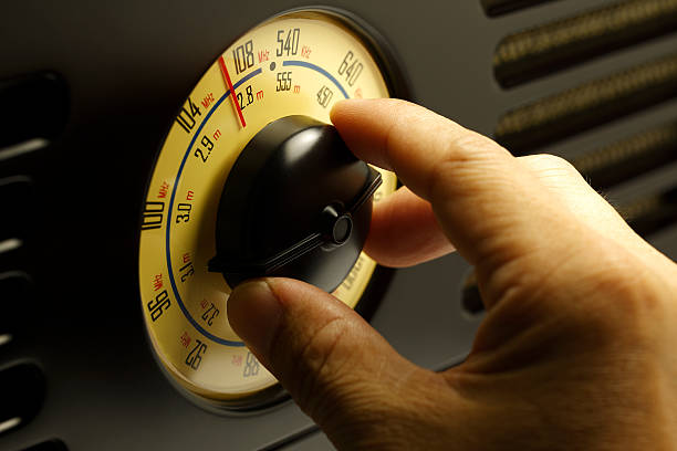 istock Hand tuning fm Retro radio knob 490646120