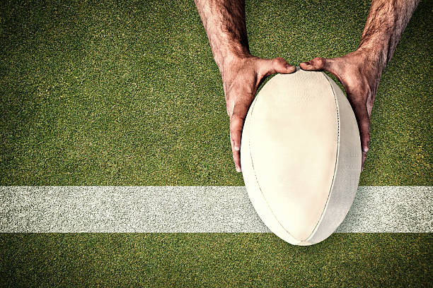 istock Composite image of man holding rugby ball 490647684